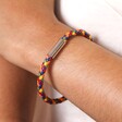 Close Up of Slim Rainbow Braided Leather Bracelet on Model